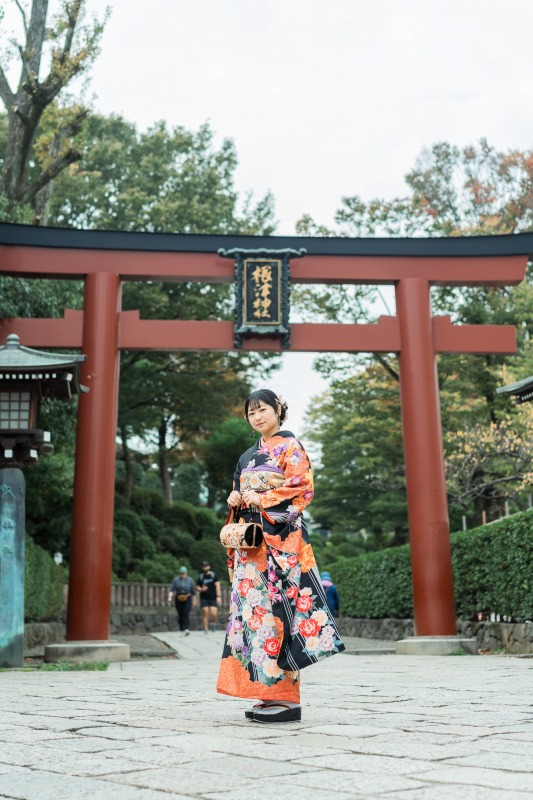 Tokyo shrine kimono portrait - standing by red torii gate
